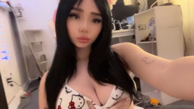 Blows Teasing With Her Big Tits In A Tight Bra
