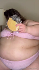 Enjoys Pastry In Her Pink Bra And Panties