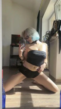 Luminatria Stretches Her Hips In Front Of The Mirror